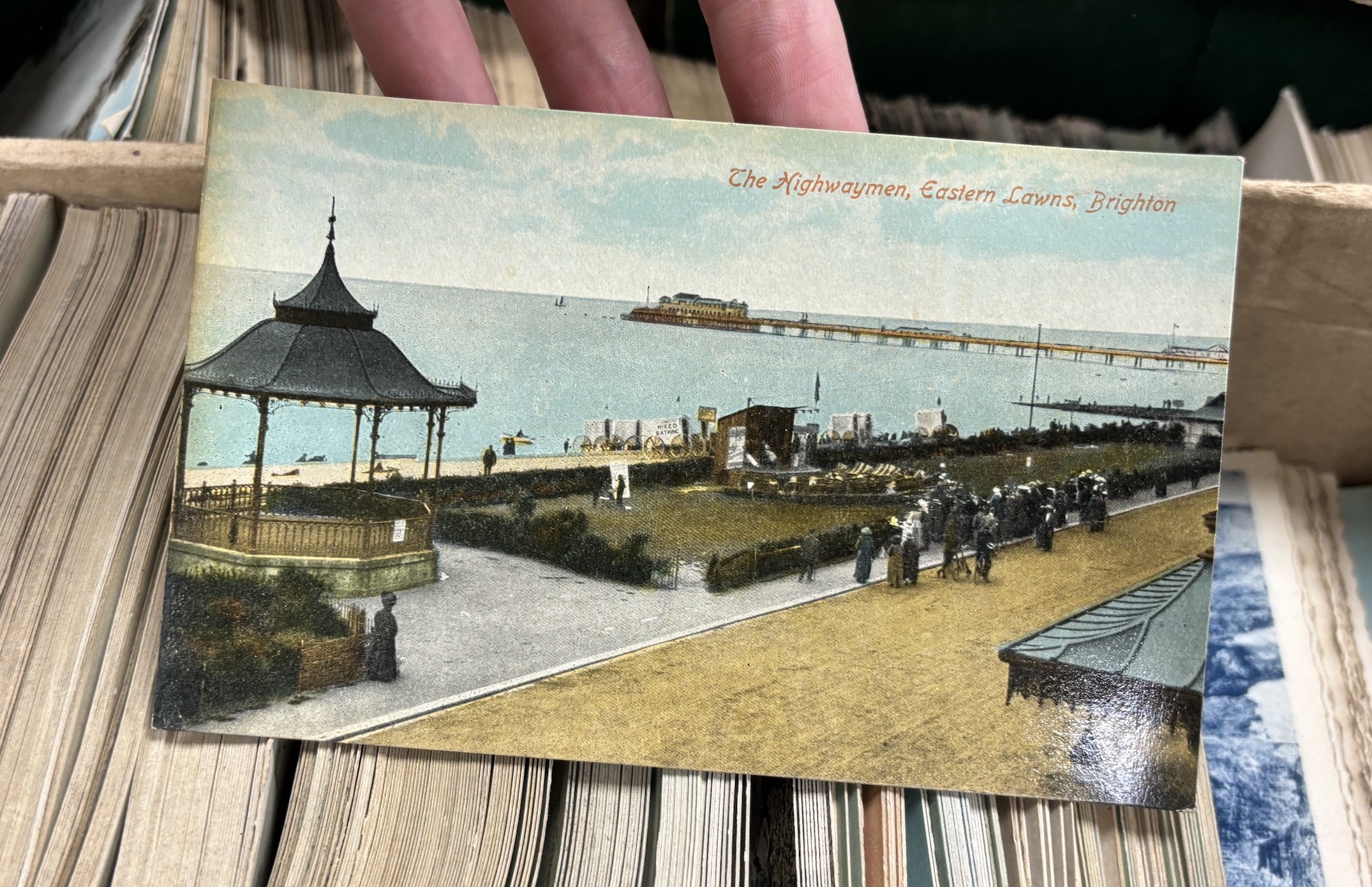 A collection of early 20th century Brighton and Hove related postcards, ex-shop stock with some still in trade boxes, multiple duplicates of the same postcard, including some from the Brighton Palace series, some publish